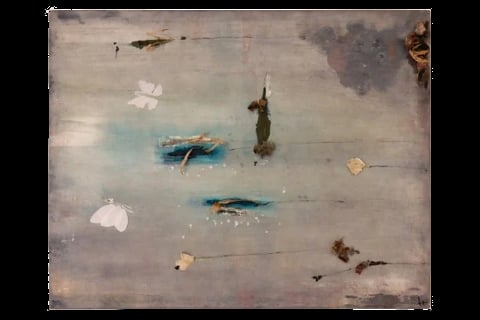 Aerial view of shallow water with scattered boats, debris, and sandy areas in muted gray and blue tones